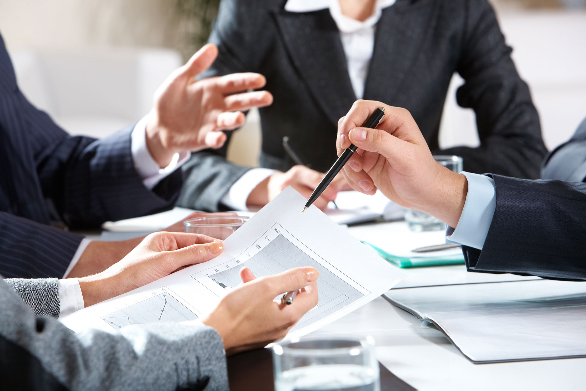 Close-up of businessman explaining a financial plan to colleague